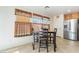 Eat-in kitchen area featuring stainless steel appliances and backyard views at 9785 Iron Mine St, Las Vegas, NV 89183
