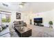 Comfortable living room with a ceiling fan, plush carpet, and a view of the city at 9785 Iron Mine St, Las Vegas, NV 89183