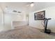Open loft area with neutral carpet and plenty of natural light at 9785 Iron Mine St, Las Vegas, NV 89183