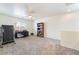 Spacious loft area with carpeting, ceiling fan, and space for an office at 9785 Iron Mine St, Las Vegas, NV 89183
