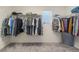 Spacious walk-in closet with ample hanging space and shelving for optimal organization at 9785 Iron Mine St, Las Vegas, NV 89183