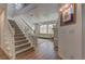 Inviting entryway showcasing a staircase and living room area at 9992 Sky Parlor Rd, Las Vegas, NV 89178