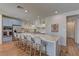 Bright kitchen boasts a large island with barstool seating and stainless steel appliances at 9992 Sky Parlor Rd, Las Vegas, NV 89178