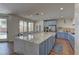 Bright kitchen featuring a large marble island, modern appliances, and stylish finishes at 9992 Sky Parlor Rd, Las Vegas, NV 89178