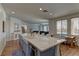 Open kitchen with a large island, modern appliances, and seamless flow to other living areas at 9992 Sky Parlor Rd, Las Vegas, NV 89178