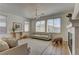Sunlit living room with a fireplace and views of the outdoors at 9992 Sky Parlor Rd, Las Vegas, NV 89178