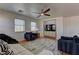 Comfortable living room with hardwood floors, ceiling fan, and neutral color scheme at 9992 Sky Parlor Rd, Las Vegas, NV 89178