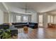 Open-concept living room with wood floors and a view to the outdoor patio at 9992 Sky Parlor Rd, Las Vegas, NV 89178