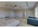 Bright main bedroom boasts a ceiling fan, natural light, and neutral finishes at 9992 Sky Parlor Rd, Las Vegas, NV 89178