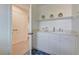 Well-lit pantry with white cabinets, counter space, and stylish floor tiles at 9992 Sky Parlor Rd, Las Vegas, NV 89178
