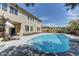 Backyard pool view with a patio, outdoor furniture, and landscaping at 9992 Sky Parlor Rd, Las Vegas, NV 89178