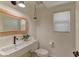 Well-lit powder room with a modern sink and a decorative mirror at 9992 Sky Parlor Rd, Las Vegas, NV 89178