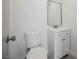 Clean half-bathroom featuring modern vanity, mirror, and toilet with gray door at 10 Yew Ave, Las Vegas, NV 89110