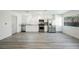 Modern kitchen with stainless steel appliances, white cabinets, granite countertops, and lots of light at 10 Yew Ave, Las Vegas, NV 89110