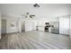 Bright open concept living room with modern kitchen, dining area, and stylish decor at 10 Yew Ave, Las Vegas, NV 89110