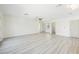 Expansive living room featuring a ceiling fan, doors, and ample natural light at 10 Yew Ave, Las Vegas, NV 89110
