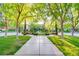 Charming street view with benches and manicured greenery, adding a touch of elegance and community spirit at 10717 Beringer Dr, Las Vegas, NV 89144
