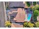 Aerial view of the home and backyard featuring the pool, hot tub and desert landscaping at 1078 Sandstone Canyon St, Henderson, NV 89012