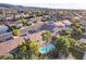 A high-angle view displays the backyard pool and patio within a suburban landscape, highlighting community living at 1078 Sandstone Canyon St, Henderson, NV 89012
