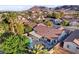 Aerial view of a private backyard with a pool, hot tub, covered patio, and lush landscaping, perfect for outdoor living at 1078 Sandstone Canyon St, Henderson, NV 89012