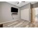 Bedroom featuring modern floors, TV, closet, and light colored walls at 1078 Sandstone Canyon St, Henderson, NV 89012