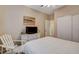 Cozy bedroom features modern floors, a TV, and beachy decor at 1078 Sandstone Canyon St, Henderson, NV 89012