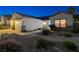 Charming single-story home featuring a two-car garage, desert landscaping, and inviting curb appeal at 1078 Sandstone Canyon St, Henderson, NV 89012
