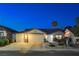 Charming single-story home featuring a three-car garage, manicured landscaping, and inviting curb appeal at 1078 Sandstone Canyon St, Henderson, NV 89012