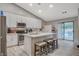 Modern kitchen with white cabinets, stainless steel appliances, and a center island with seating at 1078 Sandstone Canyon St, Henderson, NV 89012