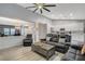 Open-concept living area with views into the kitchen, wood floors, and ample seating at 1078 Sandstone Canyon St, Henderson, NV 89012