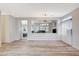 Spacious living room featuring wood-look floors and an open layout to the dining area at 1078 Sandstone Canyon St, Henderson, NV 89012