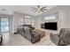 Cozy living room featuring a fireplace, comfortable seating, and a view of the backyard pool at 1078 Sandstone Canyon St, Henderson, NV 89012