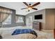 Comfortable main bedroom featuring decorative dresser, ceiling fan, and neutral color palette at 1078 Sandstone Canyon St, Henderson, NV 89012