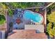 Aerial view of backyard featuring a sparkling pool, hot tub, and outdoor living space at 1078 Sandstone Canyon St, Henderson, NV 89012