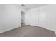 This bedroom features neutral carpet, paint, and trim, along with a double door closet at 10925 Jordyn Hill St, Las Vegas, NV 89141