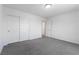 This bedroom features neutral carpet, paint, and trim, along with a double door closet at 10925 Jordyn Hill St, Las Vegas, NV 89141