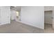 Carpeted bonus room with closet space, natural light, and a stairway access at 10925 Jordyn Hill St, Las Vegas, NV 89141