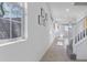 Bright entryway featuring neutral tile flooring and a staircase leading to the upper level at 10925 Jordyn Hill St, Las Vegas, NV 89141