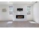 Bright living room featuring tile floors and a modern fireplace with mounted television above at 10925 Jordyn Hill St, Las Vegas, NV 89141