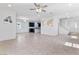 Spacious living room with tile floors connecting the kitchen and entryway at 10925 Jordyn Hill St, Las Vegas, NV 89141