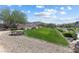 A vibrant community park offers green space, rock landscaping, and walking paths at 10925 Jordyn Hill St, Las Vegas, NV 89141
