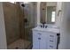 Close up on bathroom featuring a glass shower, white marble vanity, and dark hardware at 1100 Warm Canyon Way, Las Vegas, NV 89123