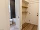 Hallway view of a powder room featuring new fixtures, tub and linen closet at 1100 Warm Canyon Way, Las Vegas, NV 89123