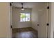 Bedroom featuring wood floors, a modern ceiling fan, and large window at 1100 Warm Canyon Way, Las Vegas, NV 89123