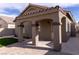 Charming home exterior featuring stucco finish, arched entry, and tiled roof at 1100 Warm Canyon Way, Las Vegas, NV 89123