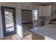 Modern kitchen featuring stainless steel appliances, white cabinets, and white marble counters at 1100 Warm Canyon Way, Las Vegas, NV 89123