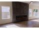 Modern living room with a linear fireplace and luxury vinyl plank flooring at 1100 Warm Canyon Way, Las Vegas, NV 89123