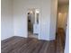 Main bedroom with an archway to a bath and wood floors at 1100 Warm Canyon Way, Las Vegas, NV 89123