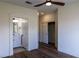 Main bedroom with wood floors, and an attached bath at 1100 Warm Canyon Way, Las Vegas, NV 89123