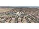 Wide aerial shot of the community near a school, featuring well-maintained streets and uniform housing at 11274 Felice Cohn Ct, Las Vegas, NV 89179